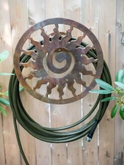 Featured Products 1 Rustic Sun Wall-Mount Garden Hose Hanger